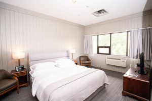 A guestroom at an Ontario resort to relax in after exploring the Haliburton Forest and Wildlife Reserve.
